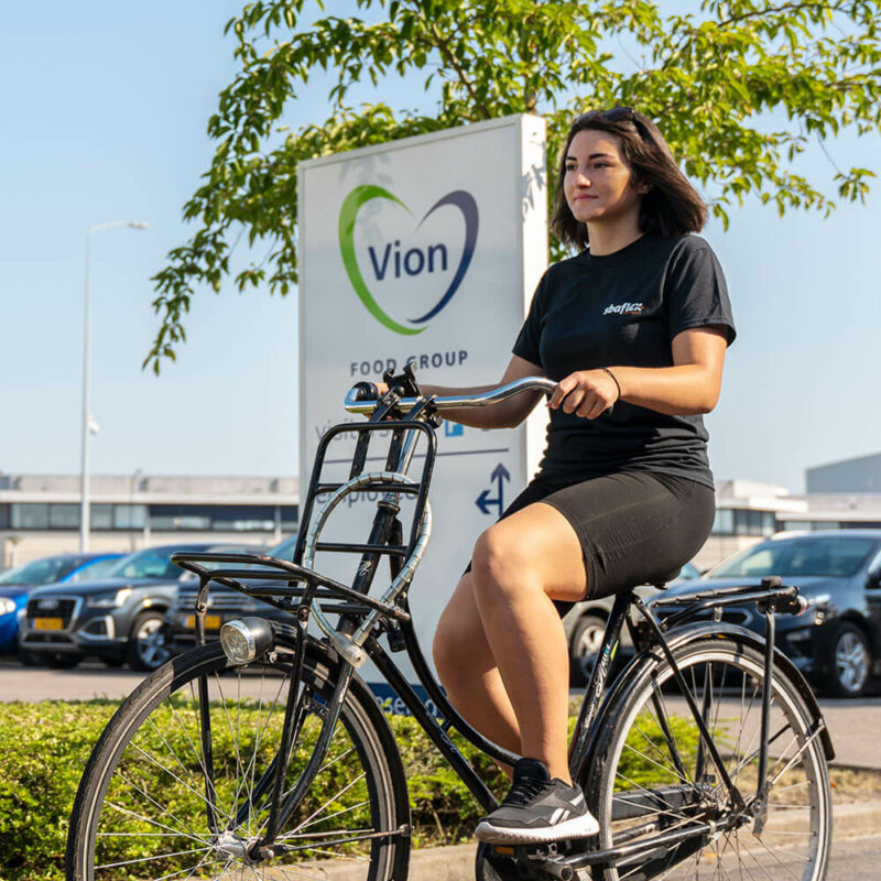 SBA Flex worker on her to work with a bike